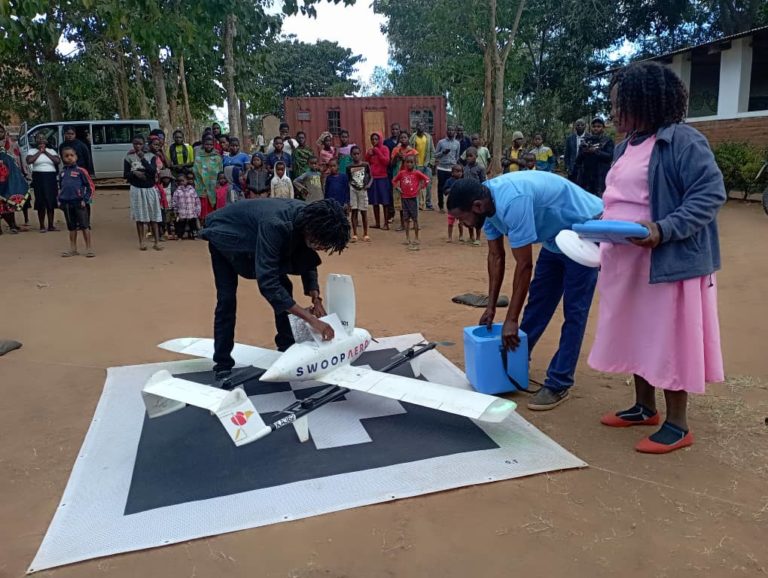 A technician assists health workers with a drone at Matawale Health Centre in Zomba. Malawi has started using drones to distribute polio vaccines.