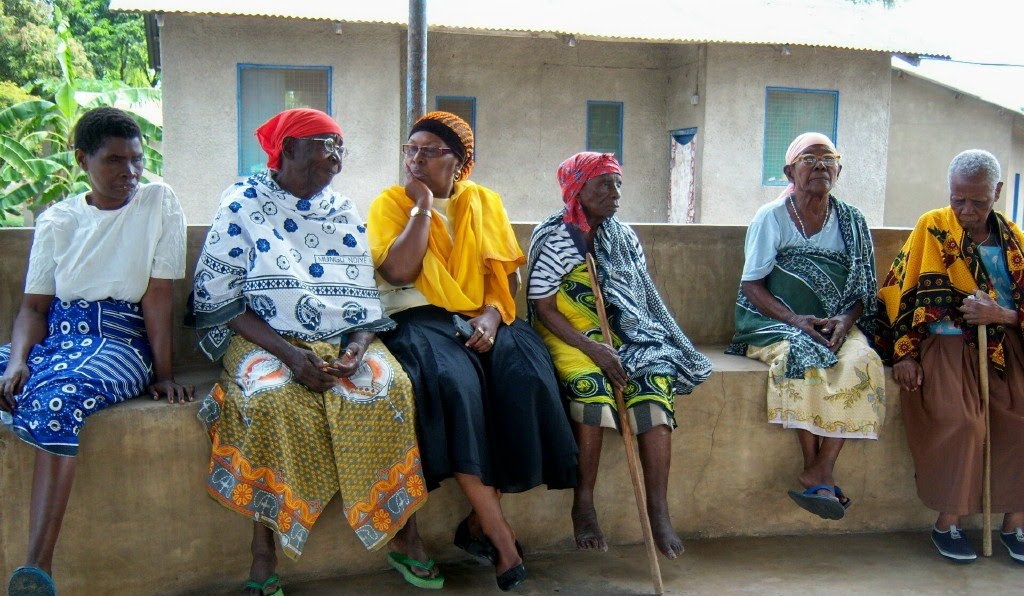 Elderly women with alzheimer's sit together