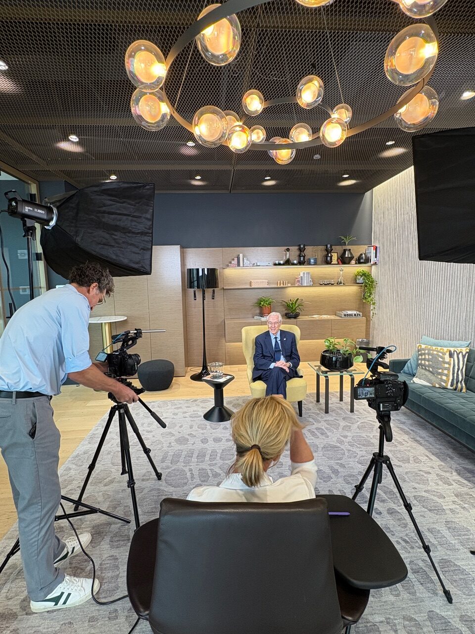 George Vradenburg filming a documentary