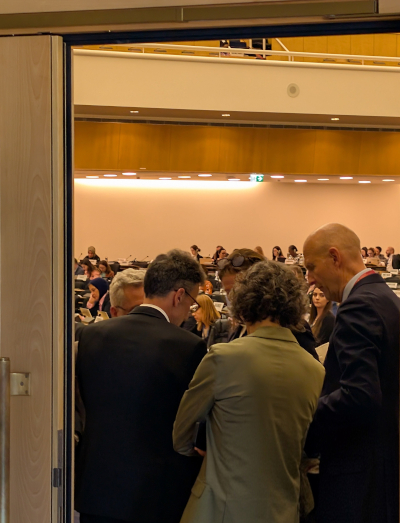The Norwegian delegation leads intense, last-minute negotiations on the assembly floor.