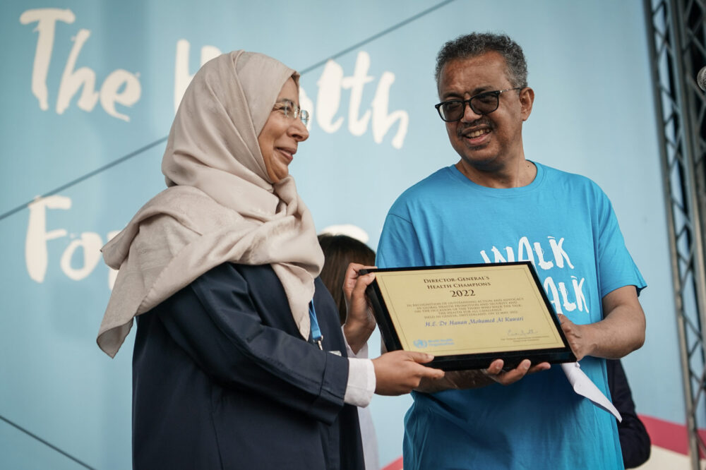 Al Kuwari receives WHO recognition for leading the FIFA World Cup health partnership, alongside persistent international scrutiny regarding occupational safety and migrant worker health.