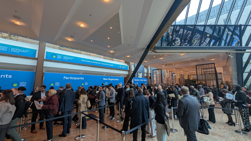 Visitors register at the World Health Summit in Berlin under the banner “From Crisis to Resilience,” with over 4,000 visitors expected in person.